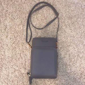 Cute crossbody purse with pouch to hold a phone.